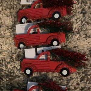 Four red truck ornaments